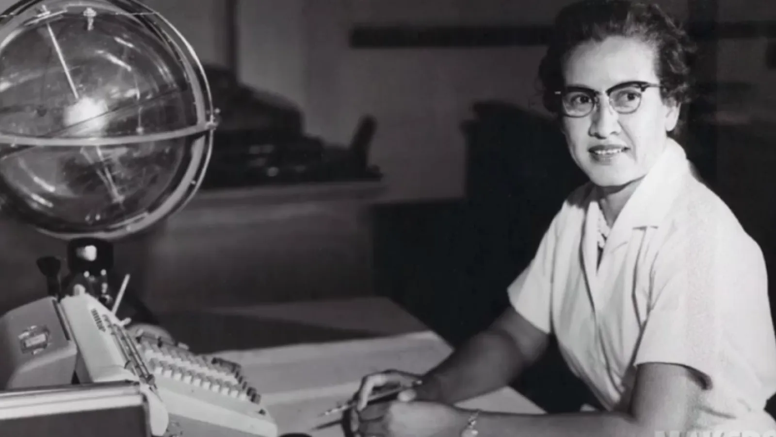 Figure 1: Katherine Johnson at work (with mechanical computer and celestial globe) Source:  https://www.nasa.gov/sites/default/files/styles/full_width_feature/public/thumbnails/image/katherine_johnson_john_glenn.png